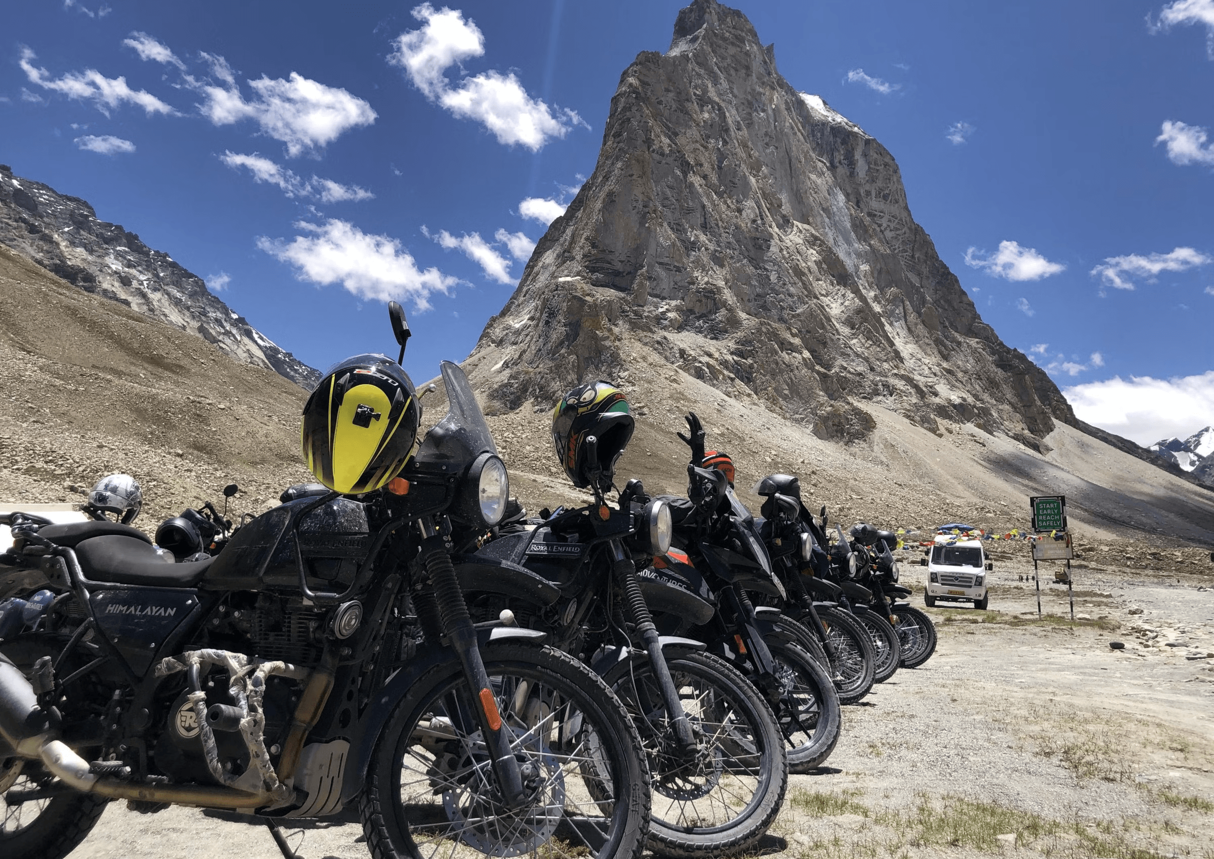 Royal Enfield bikes parked at Nubra Valley sand dunes